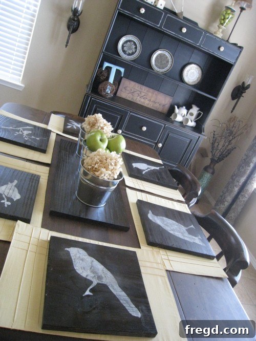 A charming dining room scene featuring the custom stenciled chargers beautifully styled with place settings