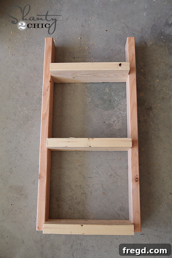 DIY One Hour Wood Wall Planter 6 Close-up of a 2x6 shelf being attached to a 2x4 side support using a Kreg Jig and screws, demonstrating the assembly process.