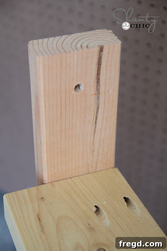 DIY One Hour Wood Wall Planter 8 Close-up of a 3/8 inch hole being drilled near the top of a 2x4 side support, preparing the planter for rope hanging.