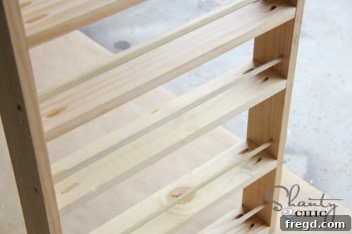 Inserting Dowels Inserting wood dowels into the prepared holes on the spice rack