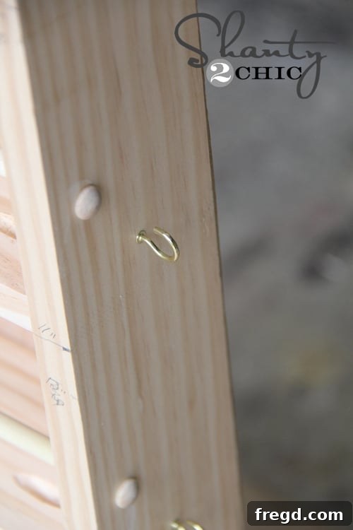 Measuring Spoon Holder Cup hooks added to the side of the spice rack for hanging measuring spoons