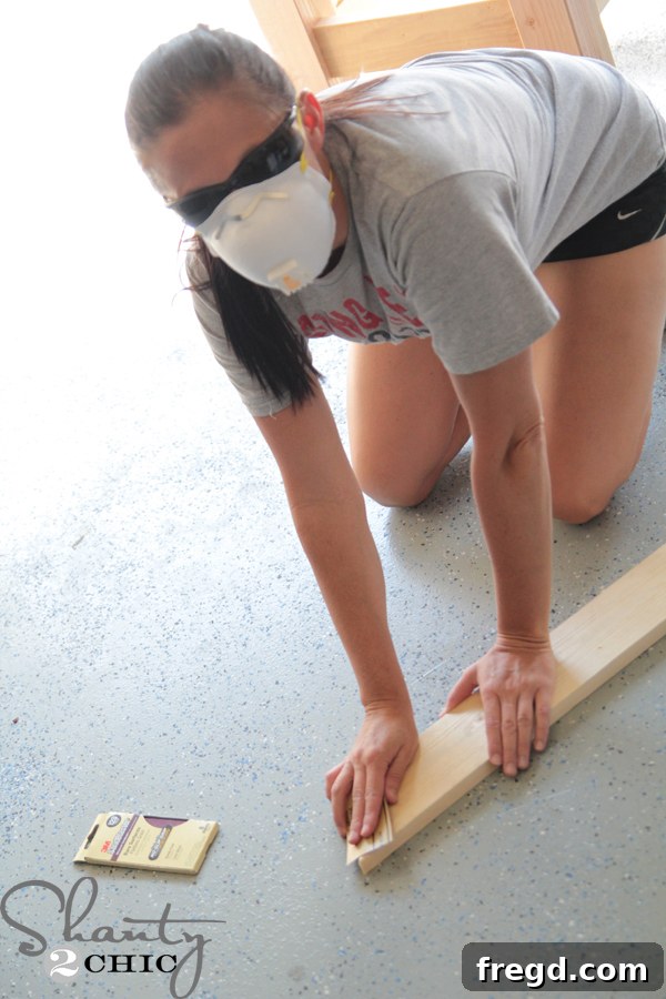 Person wearing a 3M mask for protection while sanding