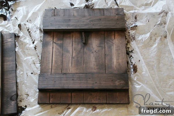 Close-up of the frame with one coat of stain applied and blended.
