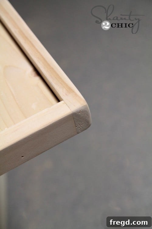 Sanding the edges of the mirror frame