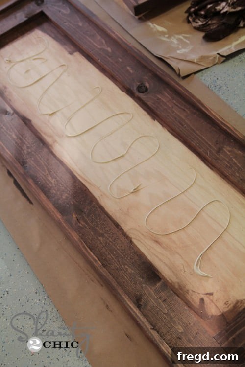 Mirror adhesive being applied to the frame
