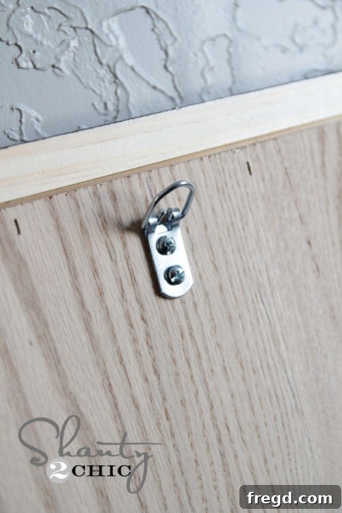 D-rings attached to the back of the mirror