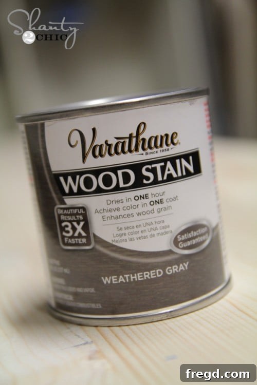 Applying Varathane Weathered Gray wood stain to the assembled sign