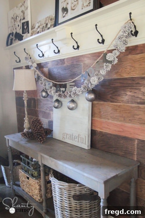 Entryway styled with DIY wood sign, creating a welcoming and personalized atmosphere