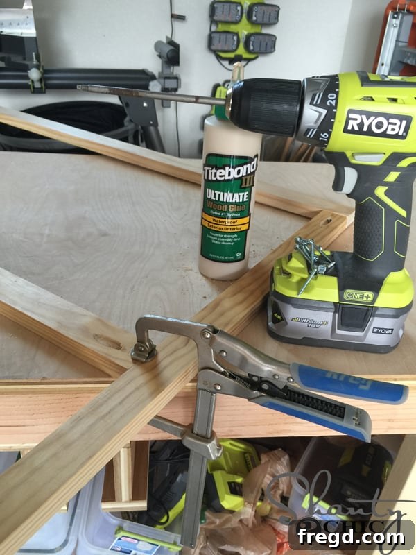 Using a Kreg Bar Clamp to attach the middle piece of the face frame