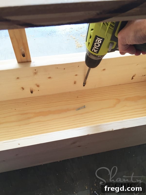 Attaching the top piece to the cabinet frame