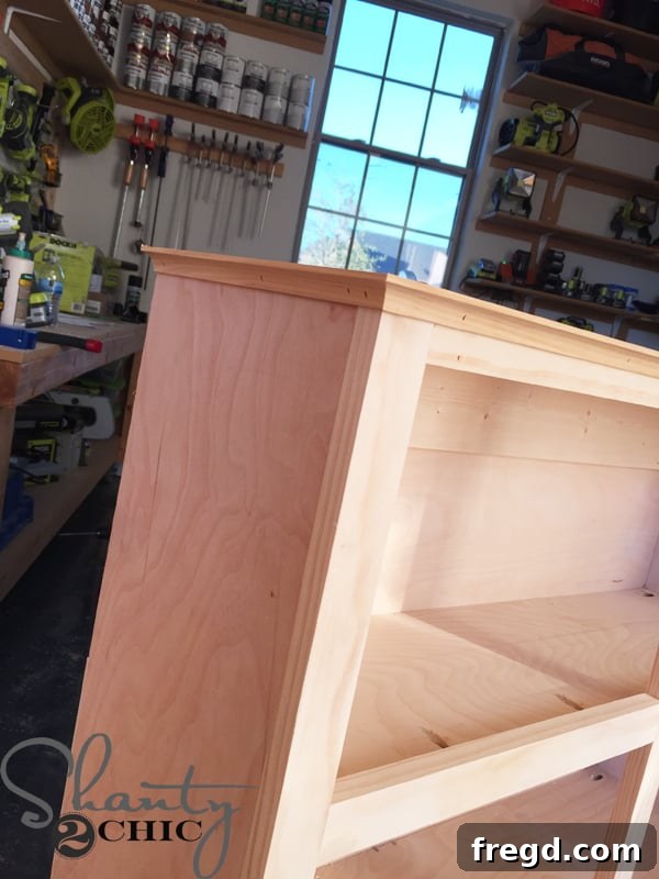 Attaching bottom cove molding with wood glue and brad nailer