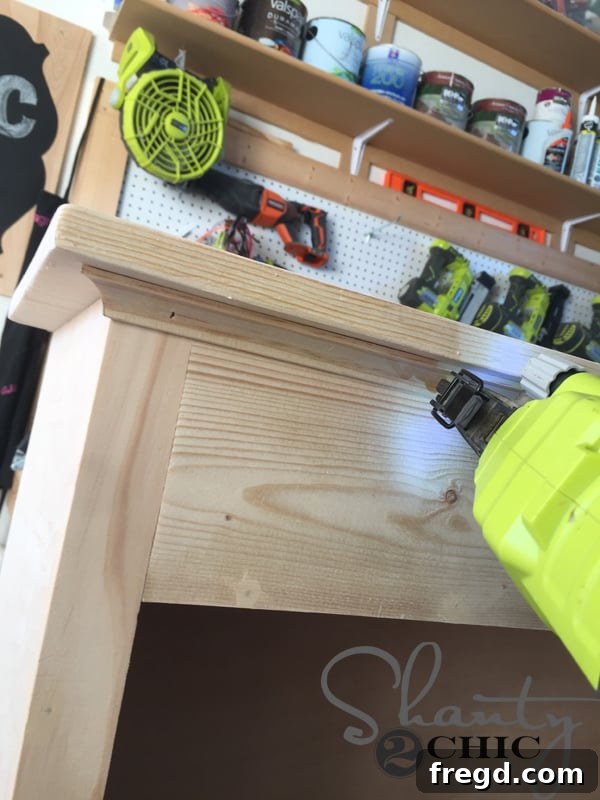 Attaching top cove molding to the cabinet