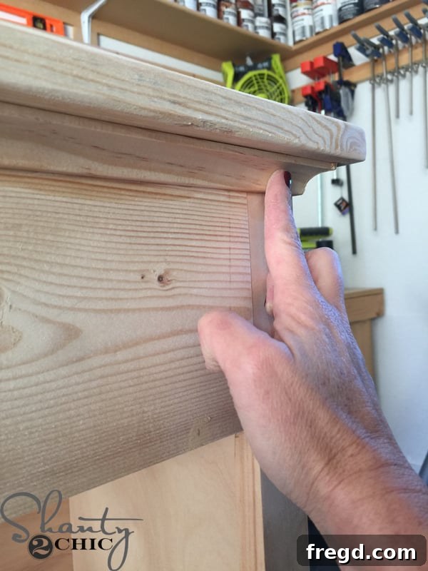 Filling nail holes with wood filler for a smooth finish