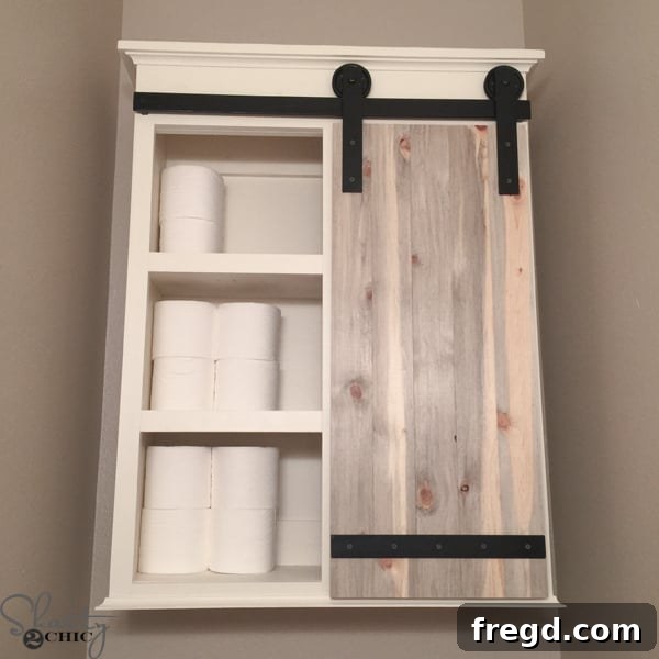 DIY Storage for Bathroom showing sliding barn door closed