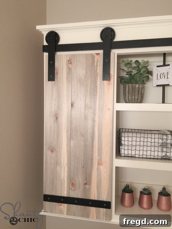 Close-up of sliding barn door mechanism on bathroom cabinet