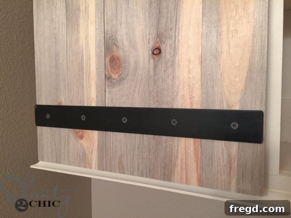 Barn door strap hardware detail on cabinet