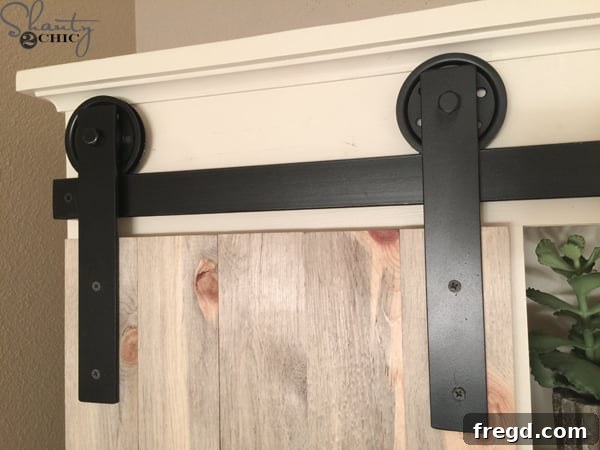 Sliding barn door hardware close-up for cabinet