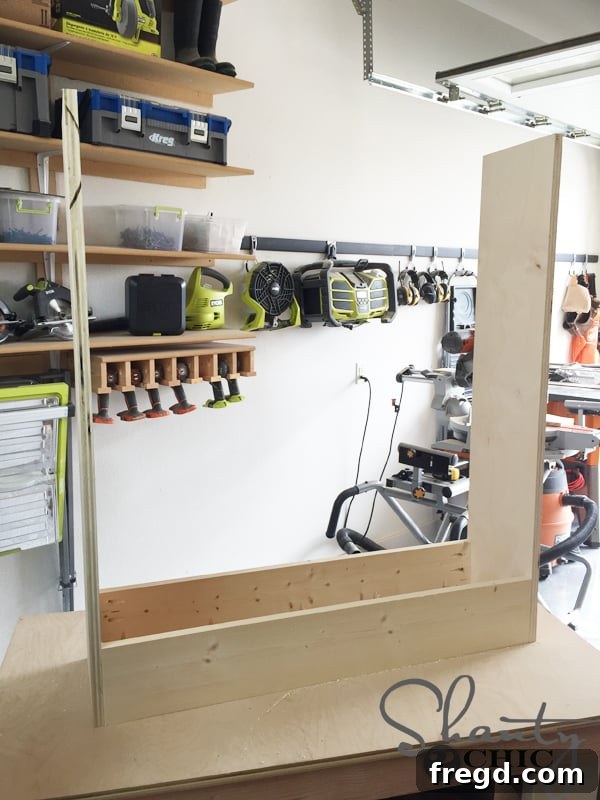 Cabinet frame with top pieces attached, turned upside down