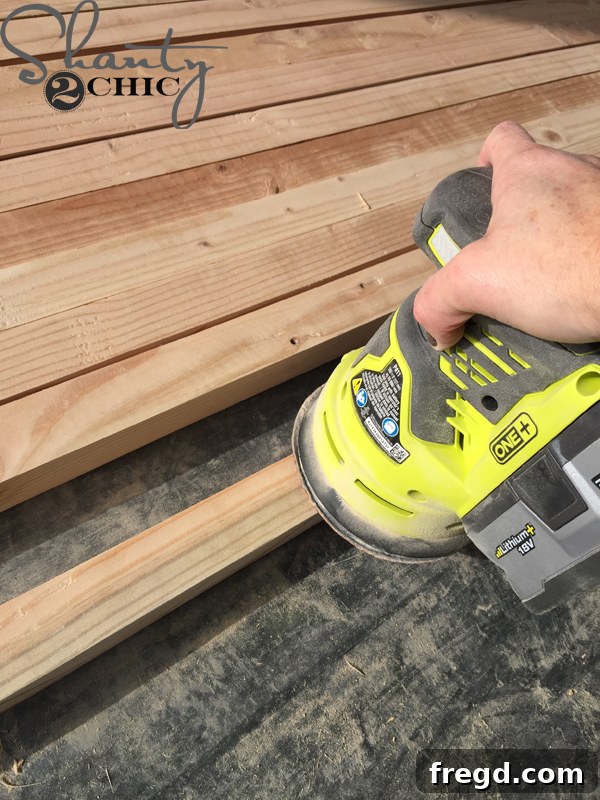 Sanding ripped boards smooth for office tower construction