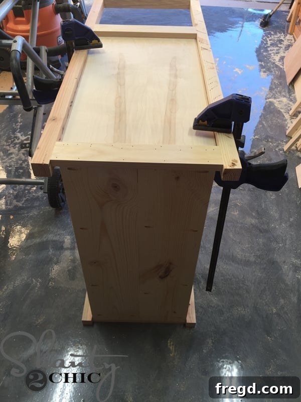 Clamping a ladder to the cabinet base
