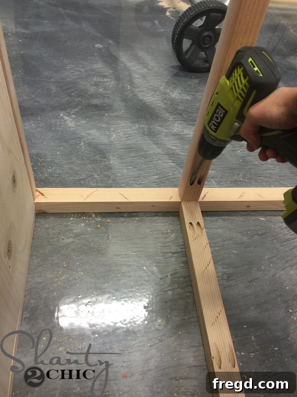 Attaching front horizontal rails to the office tower
