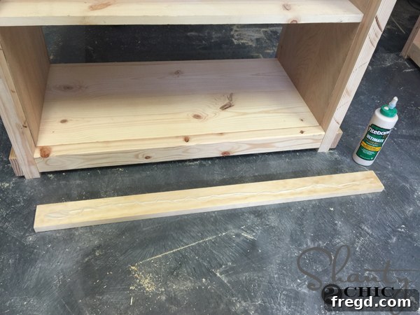 Applying wood glue to front trim piece