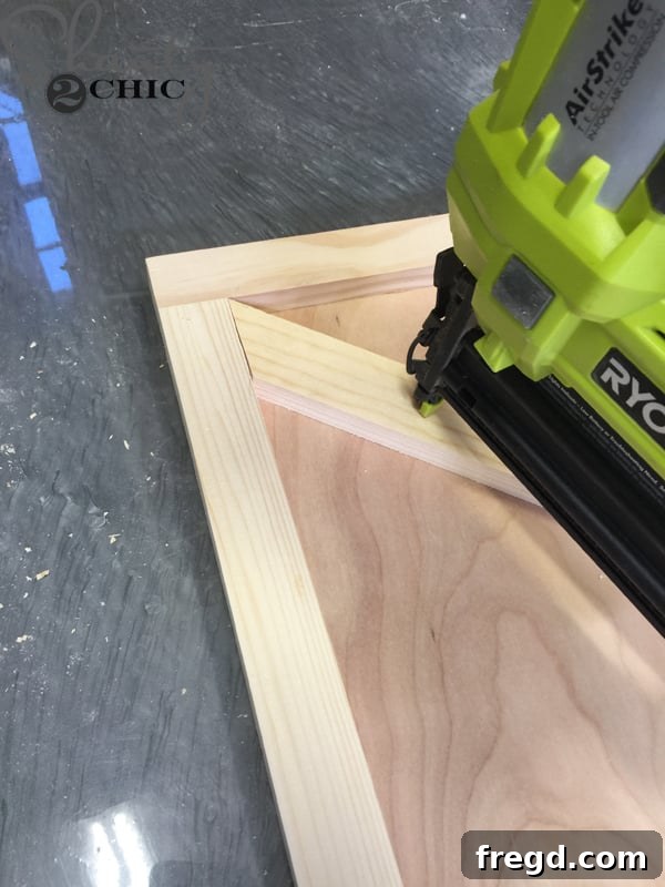 Attaching 'X' piece to the door with wood glue and staples