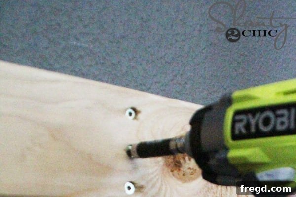 Attaching the cleat to the wall studs and corbels with screws