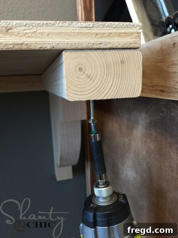 Attaching the plywood desk top to the cleat with screws