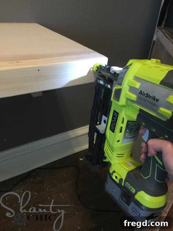 Attaching the front 2x3 trim piece to the floating desk