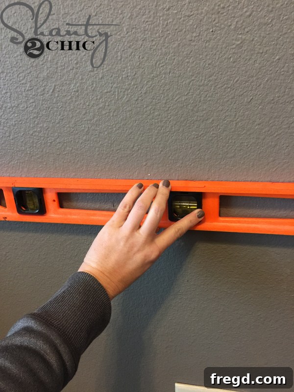 Marking the desk top position on the wall