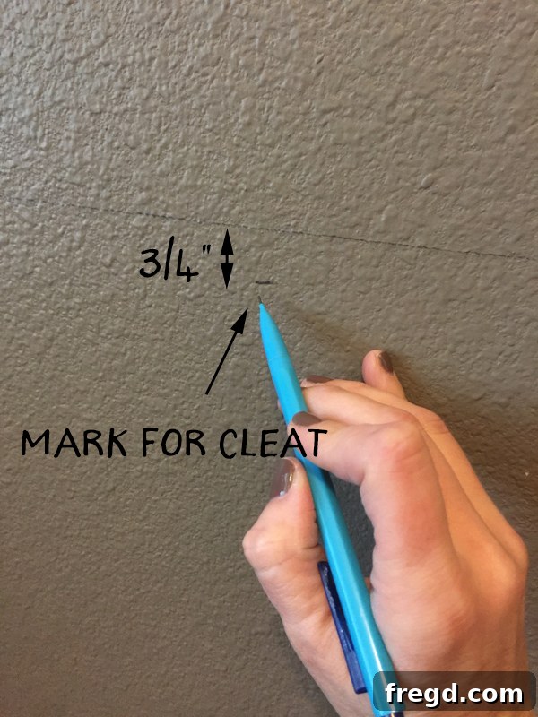 Marking the wall for cleat and corbel placement