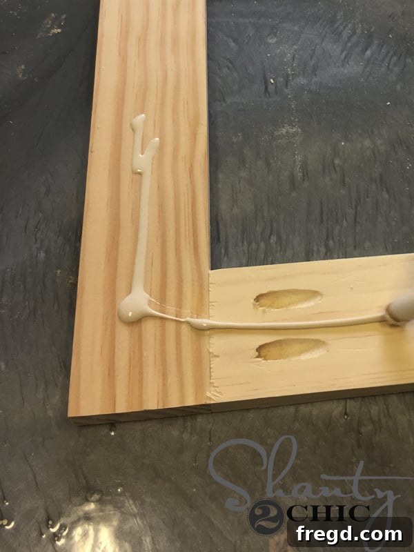 Applying wood glue to the back of the door frame