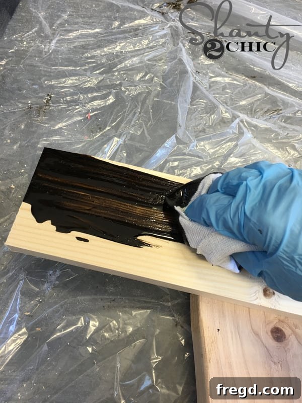 Applying Rust-Oleum Dark Walnut stain to wood