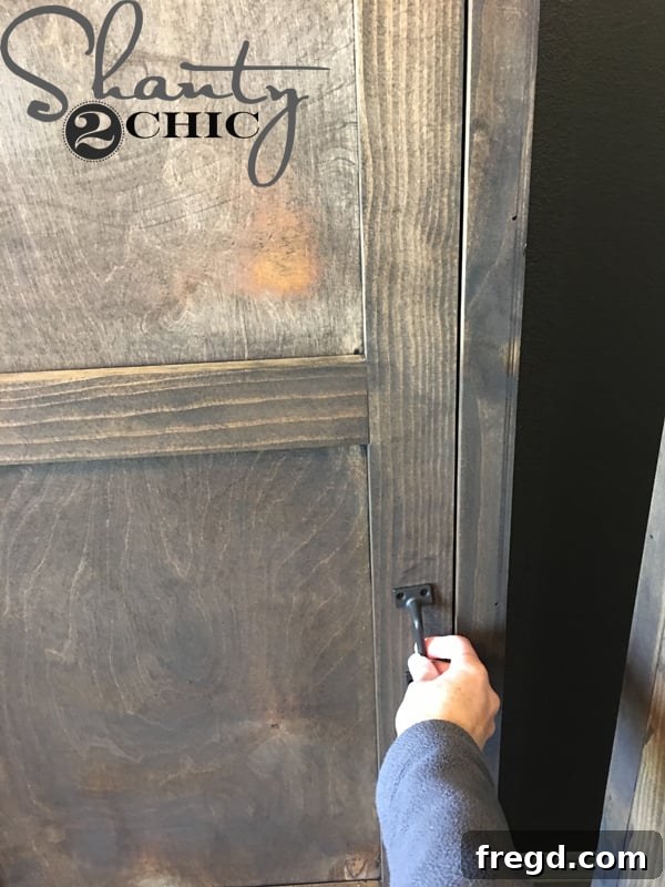 Attaching metal door pull to locker door