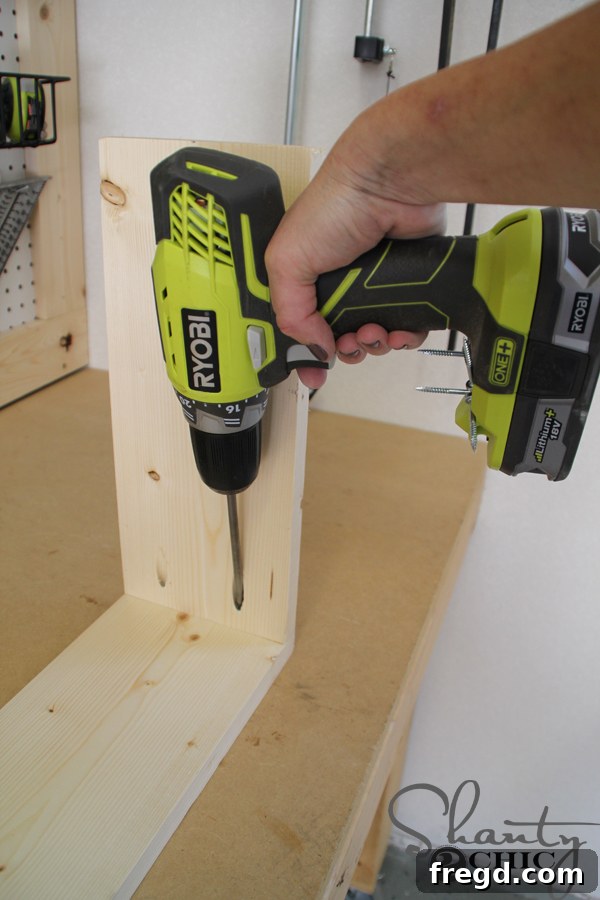 Attaching side pieces to the long front piece of the desk frame using pocket holes