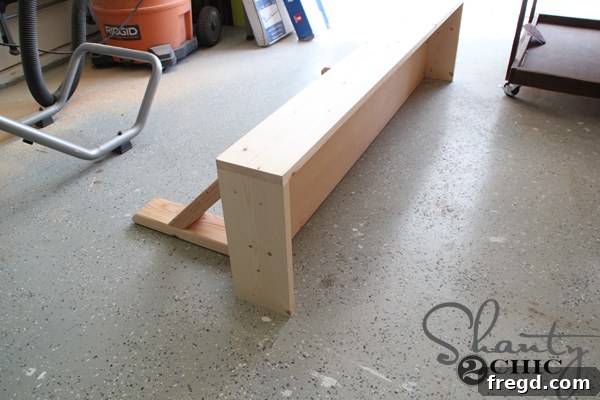Attaching the assembled front frame to the desk bottom