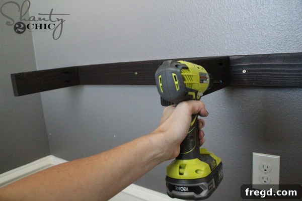 Attaching the middle support piece to the wall cleat after initial installation
