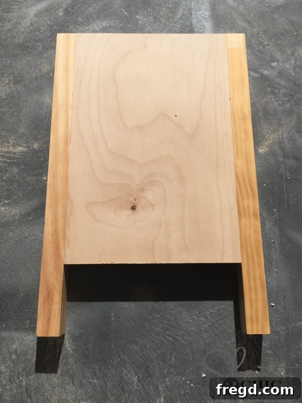 Inside view of assembled vanity side piece with shelf pin holes
