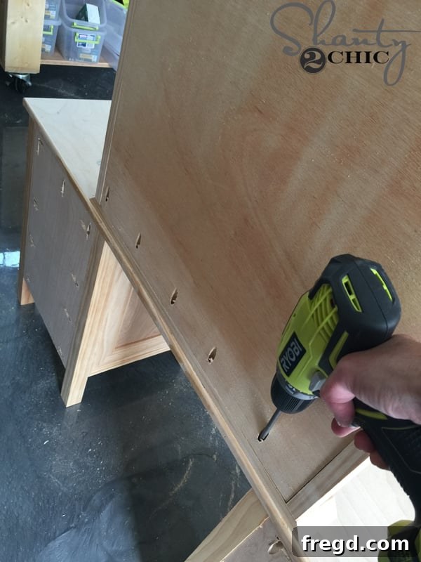Attaching middle mirror piece to vanity base