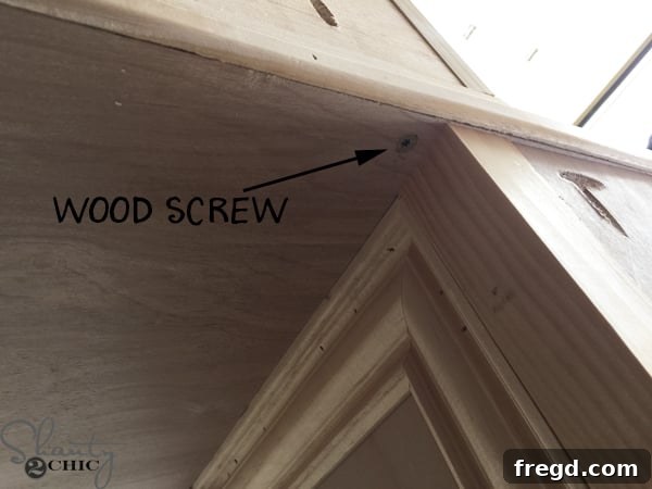 Reinforcing mirror base with wood screws from underneath vanity top
