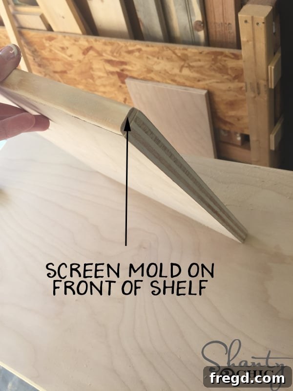 Attaching screen mold to front edge of vanity shelf