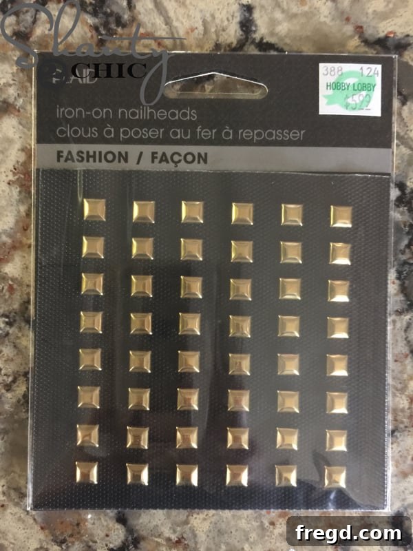 Gold studs added to cardboard tote corners