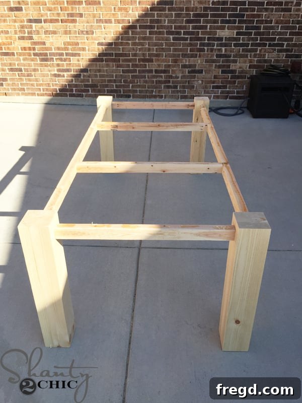 DIY Modern Open Concept Farmhouse Table HGTV Style 11 Modern farmhouse table frame with all cross supports in place