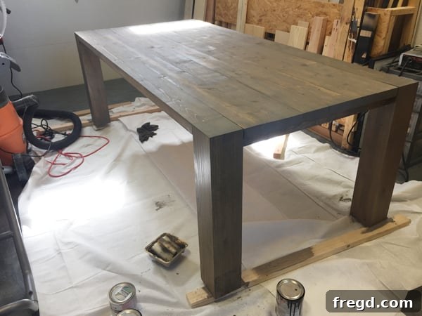 DIY Modern Open Concept Farmhouse Table HGTV Style 17 Modern style farmhouse table after staining, before topcoat