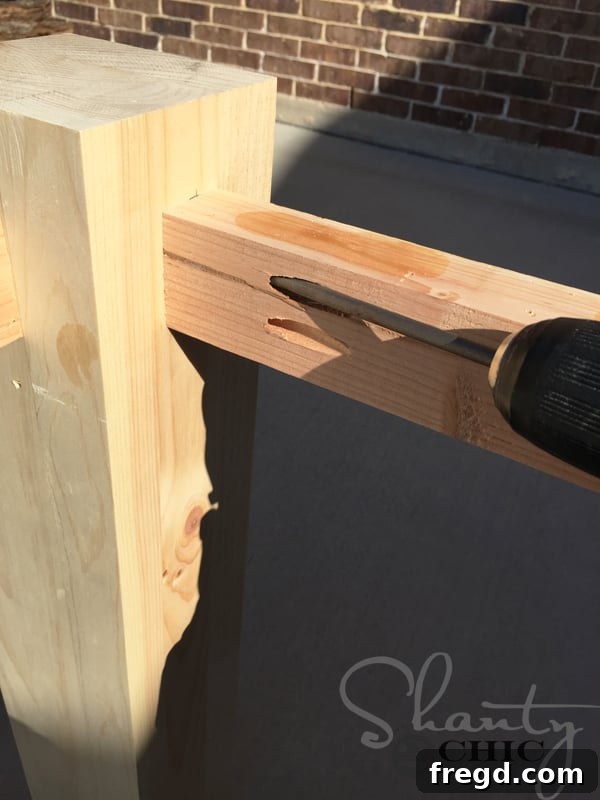 DIY Modern Open Concept Farmhouse Table HGTV Style 7 Detail of apron attached to table leg, showcasing proper alignment