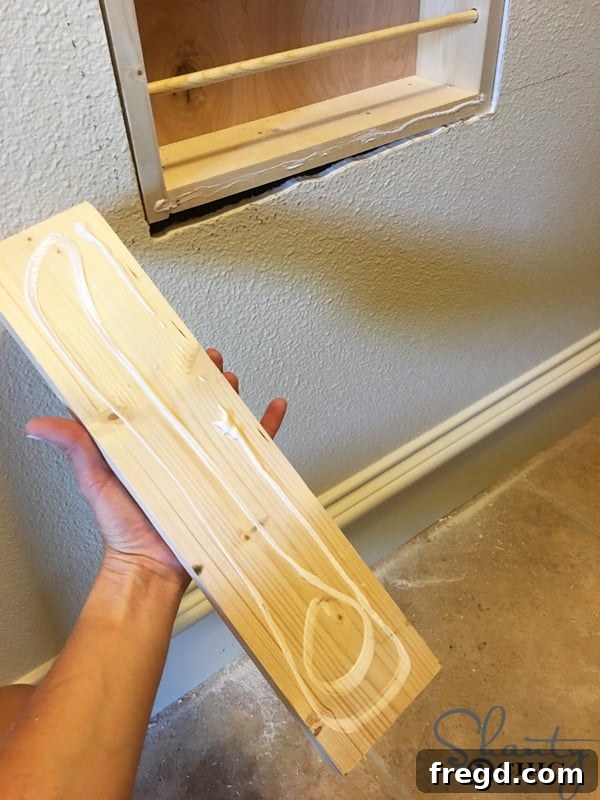apply-glue-to-bottom-trim-piece