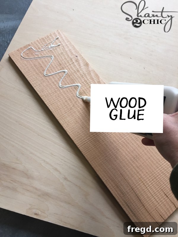 DIY Vertical Garden Planter 6 apply-wood-glue-to-back-of-barn-wood