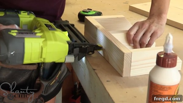 Attaching the bottom 1x3 piece to the mitered 2x3 pieces of the mail sorter