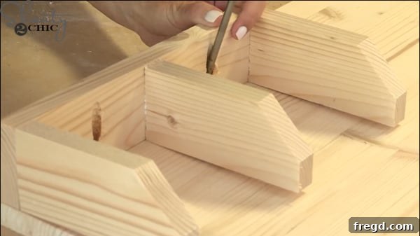 Applying wood glue and placing the mail sorter onto the craft board back panel